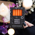 Load image into Gallery viewer, Pack of 12 Orange 'Confidence' Spell Candles