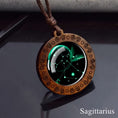 Load image into Gallery viewer, Sagittarius zodiac star sign glass and wood pendant necklace on faux leather cord
