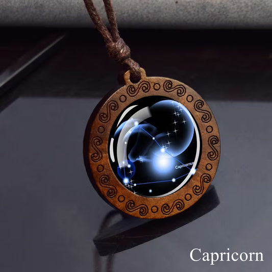 Capricorn zodiac star sign glass and wood pendant necklace on faux leather cord