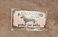 Load image into Gallery viewer, A Dachshund Lives Here Hangable Wooden Sign
