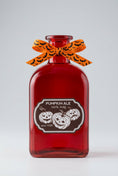 Load image into Gallery viewer, Pumpkin Ale decorative glass bottle with cork stopper for Halloween decor
